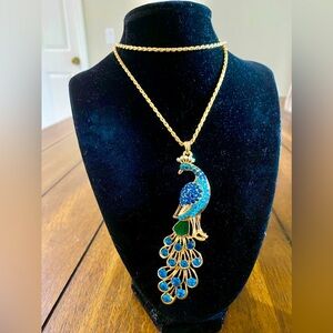 NWOT “Blue Crystals Peacock Gold Necklace”